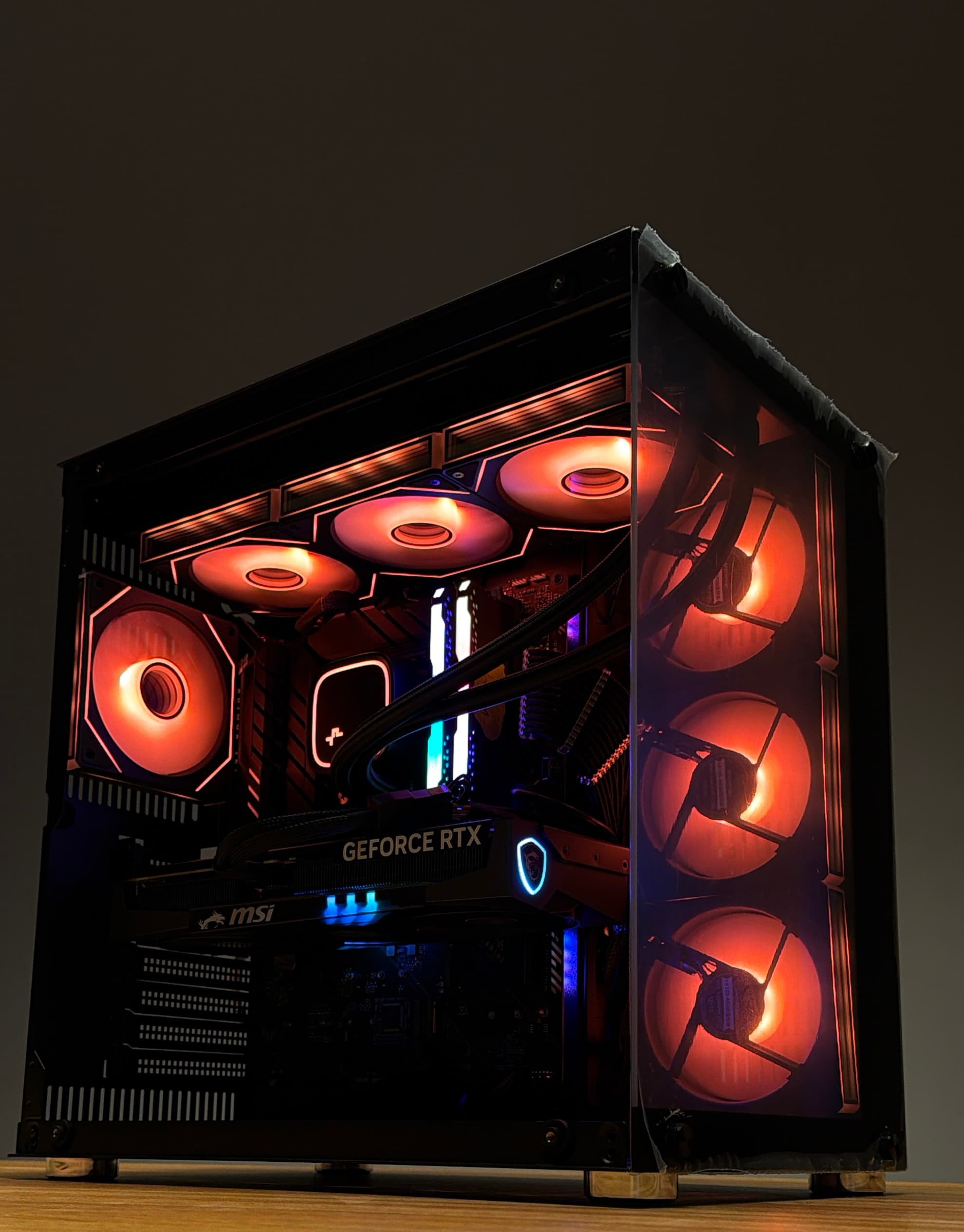Orange gaming tower — three-quarter angle